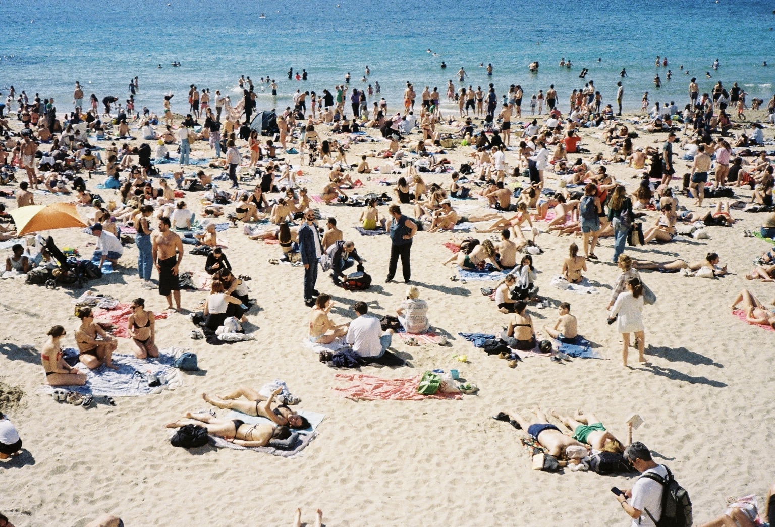 Collective Leisure - Crowded beach scene